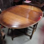 An oak gateleg dining table