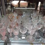 A large collection of drinking glasses including c