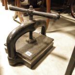 A cast iron book press