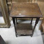 An oak occasional table on barley twist supports