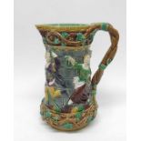 A Minton majolica Tower jug, relief moulded with d