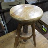A pine adjustable stool