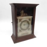 A marble cased mantel clock with cast metal lion s