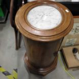 A Victorian mahogany circular marble topped pot cupboard