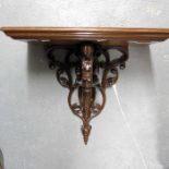 A carved wooden wall bracket 40cm high