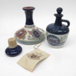 Two ceramic bottles of rum including Lamb's Navy R