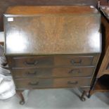 A mahogany veneered bureau