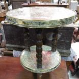 A brass topped table with embossed Chinese decorat