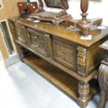 A 17th Century style carved oak buffet, with three