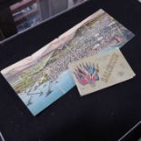 A vintage folding postcard and a postcard book