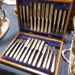 A set of twelve plated fruit knives and forks in f