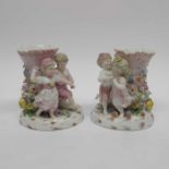 A pair of Continental porcelain spill vases, model