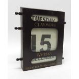 A Claymore Whiskey oak desk calendar.