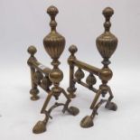 A pair of Late 19th Century brass fire dogs with u