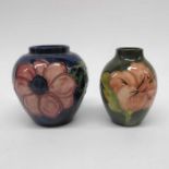 A Moorcroft hibiscus on green vase, baluster form,