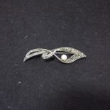 A silver, marcasite and cultured pearl brooch
