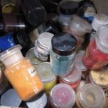 A large collection of paint pigments in jars, vari