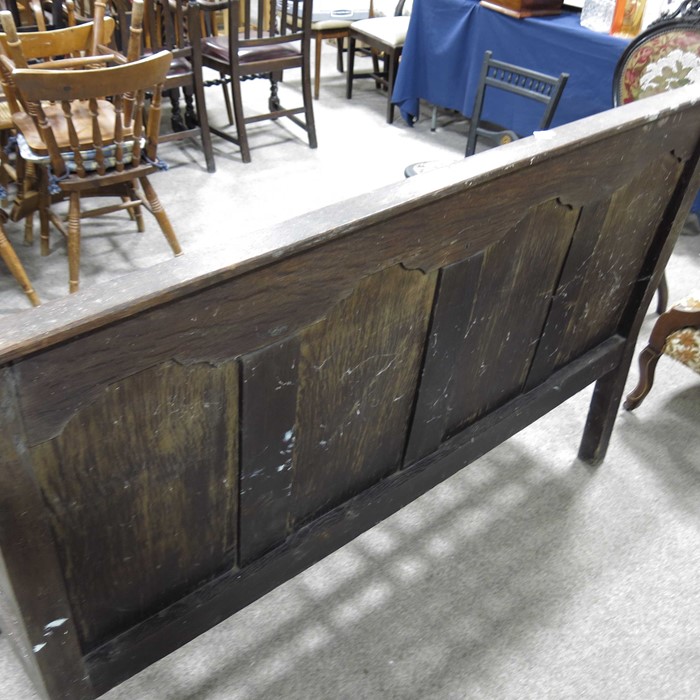 A George III oak settle, four panel back with open arms - Image 2 of 3