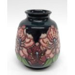 Moorcroft floral patterned vase, squat inverse bal