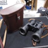 A pair of Soviet binoculars, in brown leather case