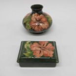 Walter Moorcroft, hibiscus pattern on green vase,