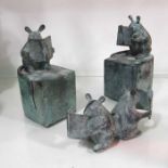 A pair of bronzed figural bookends, in the form of