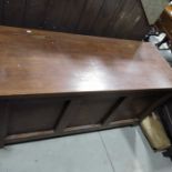 A stained pine blanket chest with lift up lid above three fielded panels