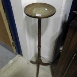 An Edwardian torchiere on flared tripod base