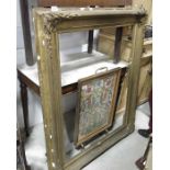 A large gilt gesso frame, aperture 78 x 99cm and o