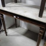 A Victorian mahogany marble top side table, on tur