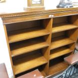 A Yew wood veneered bookcase with adjustable shelv