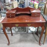 A Reproduction stained beech dressing table or desk