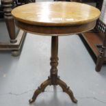 A circular occasional table on turned support and