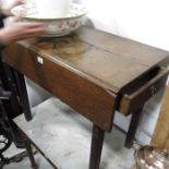 An antique oak side table, single drop-flap on squ