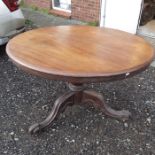 A mahogany circular tilt-top breakfast table, balu