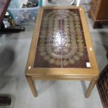 A Nathan teak tile top coffee table