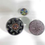 A Paul Ysart millefiori star paperweight, a packed cog and millefiori paperweight