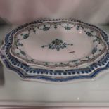 A French faience oval platter, oval scalloped form