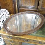 Two Edwardian oval wall mirrors and a Victorian fi
