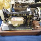 A Singer hand sewing machine, model number F882860