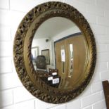 A plaster framed convex wall mirror, 62cm diameter