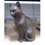 A resin figure of a tabby cat