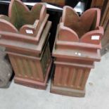 A pair of Terracotta reeded tulip topped chimney pots