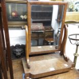 A figured mahogany toilet mirror, 60cm high, 46cm