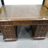 A Victorian mahogany pedestal desk, leather inset