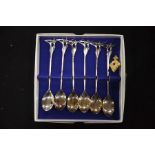 A boxed set of modernist silver plated spoons, tog