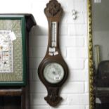 An oak cased aneroid barometer, 68cm high