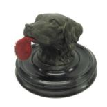 A Victorian novelty inkwell cast in the form of a