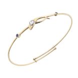 An early 20th century gold, diamond and sapphire snake bangle