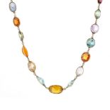 An Edwardian silver harlequin multi-gem necklace, with gold clasp
